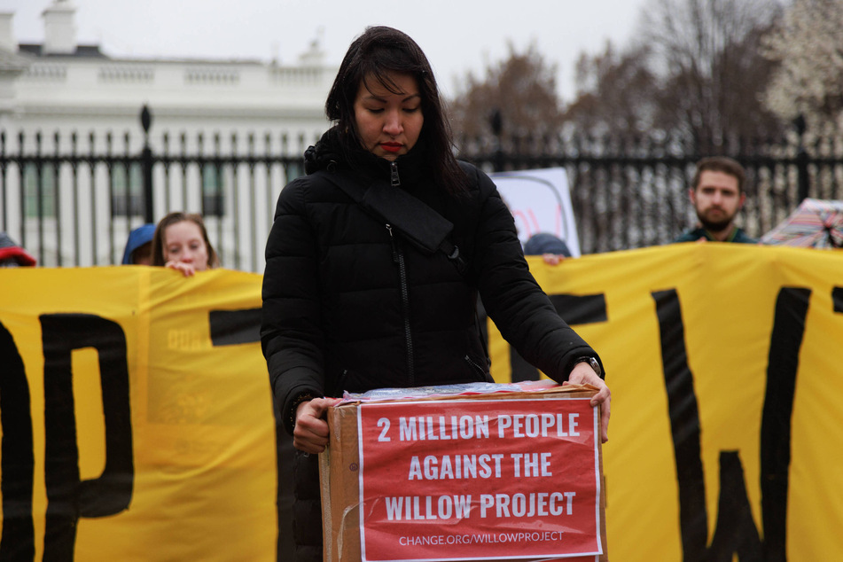 Demonstrators gather near the White House demanding that President Biden stop the Willow Master Development Plan.