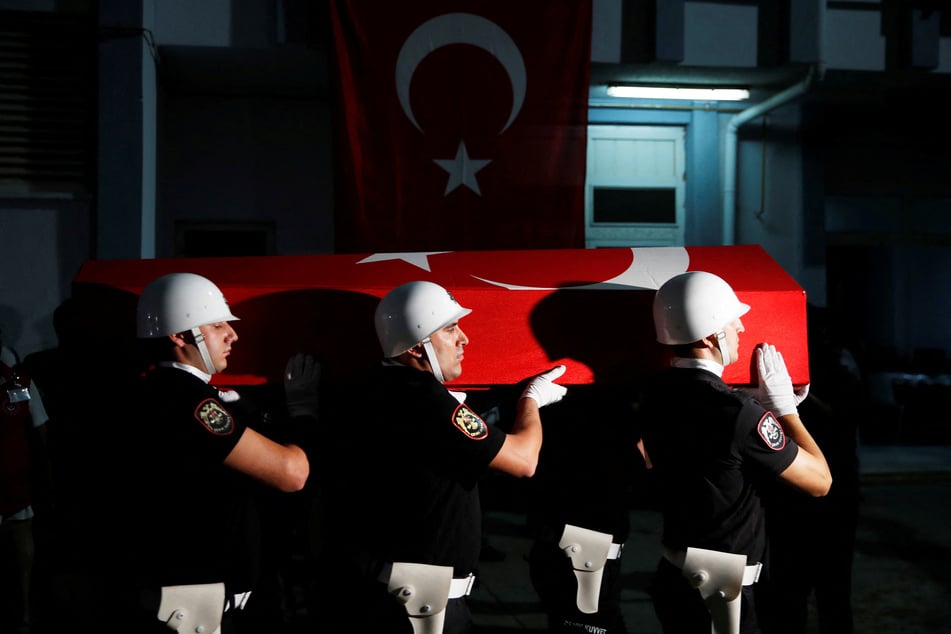 The coffin of Aysenur Ezgi Eygi, a Turkish-American activist killed in the Israeli-occupied West Bank, is carried by Turkish police officers to a morgue in Didim.