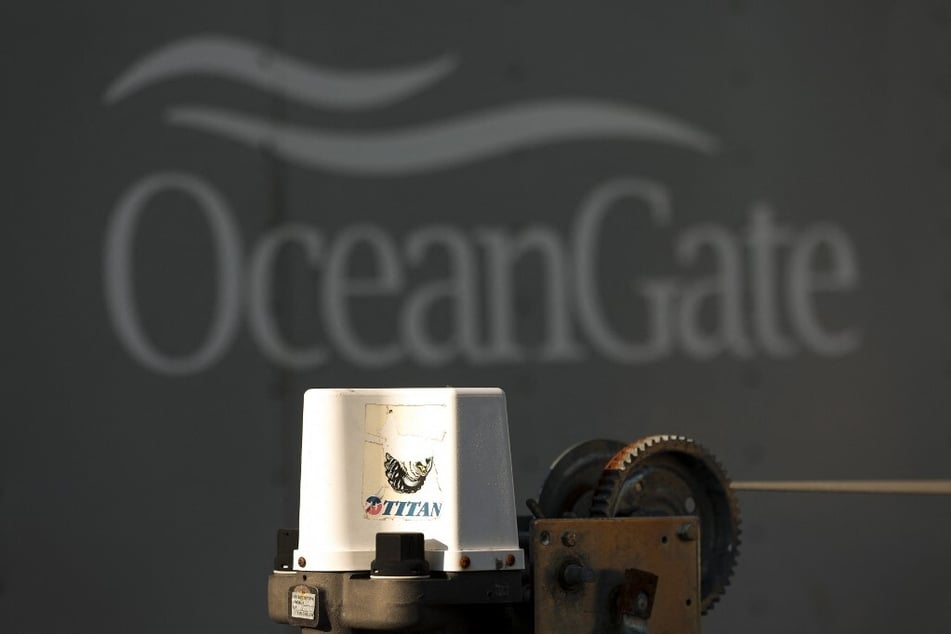 A decal on a piece of equipment which reads "Titan" is pictured near a trailer with the OceanGate logo at the company's headquarters in Everett, Washington.