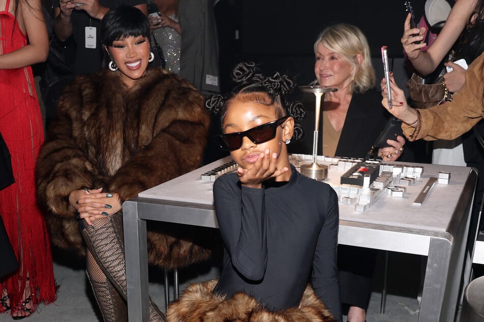 (L-R) Cardi B, Kulture Kiari Cephus, and Martha Stewart attend the Alexander Wang show during September 2025 New York Fashion Week on Friday in New York City.
