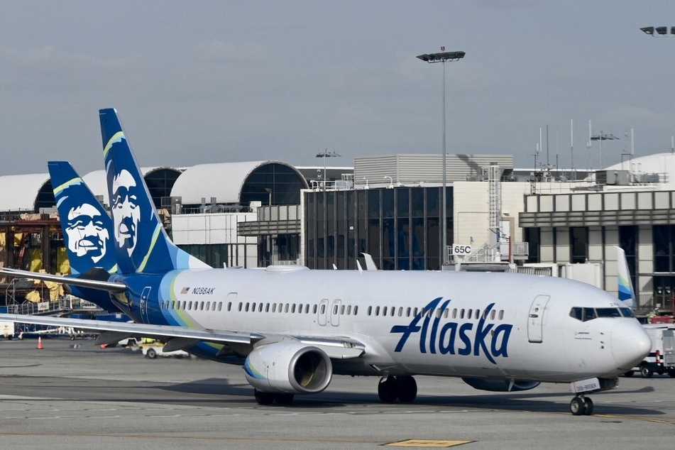 An off-duty pilot has been indicted for trying to shut down the engines of an Alaska Airlines plane in midair.