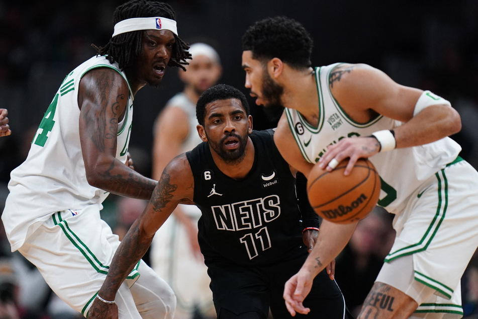 This week, Kyrie Irving (c.) and the Brookyln Nets suffered their worst loss in nine years to the Boston Celtics, Irving's former team.