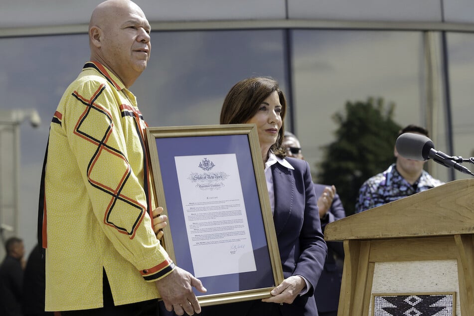 Seneca Nation President J.C. Seneca (l.) stands alongside New York Governor Kathy Hochul as she issues a formal apology for the Thomas Indian School.