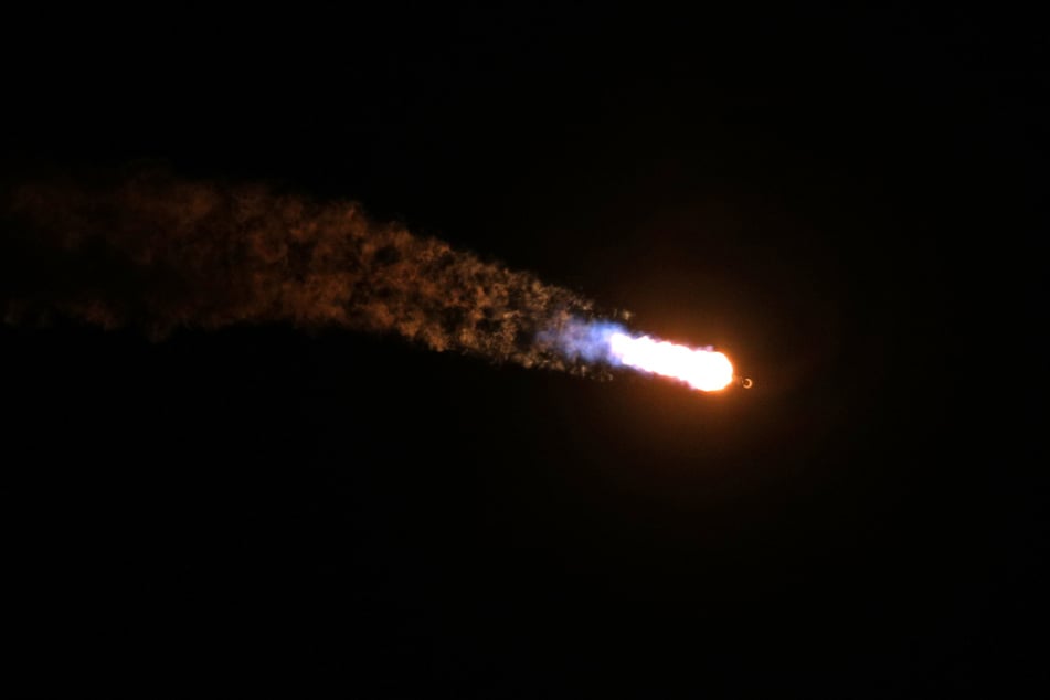 A SpaceX Falcon 9 rocket, carrying Firefly Aerospace's Blue Ghost and ispace's Resilience lunar landers, soars into orbit after lifting off from Launch Complex 39A at the Kennedy Space Center in Cape Canaveral, Florida, on Wednesday.