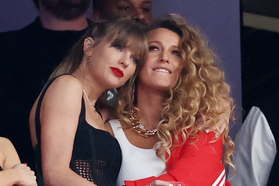 Blake Lively (r.) is reportedly staying under the radar despite speculation that one of Taylor Swift's (l.) songs on The Life of a Showgirl is in support of the Gossip Girl alum.