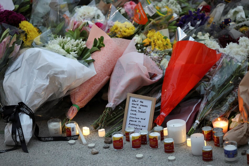 Floral tributes are laid at Bondi Pavilion to pay respect to the victims of a shooting during a Jewish holiday celebration, in Sydney, Australia, on December 15, 2025.