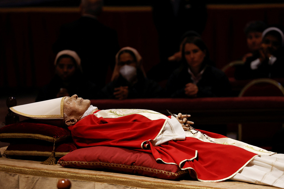 People pay homage to former Pope Benedict in St. Peter's Basilica at the Vatican on January 2, 2023.