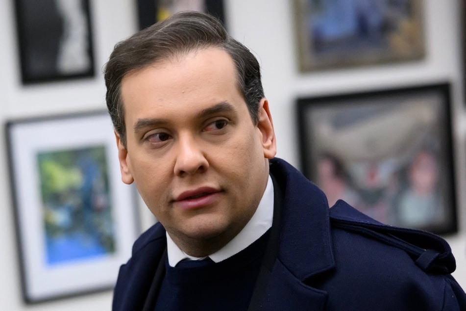 George Santos walks from his office to the US Capitol in Washington DC on December 1, 2023.
