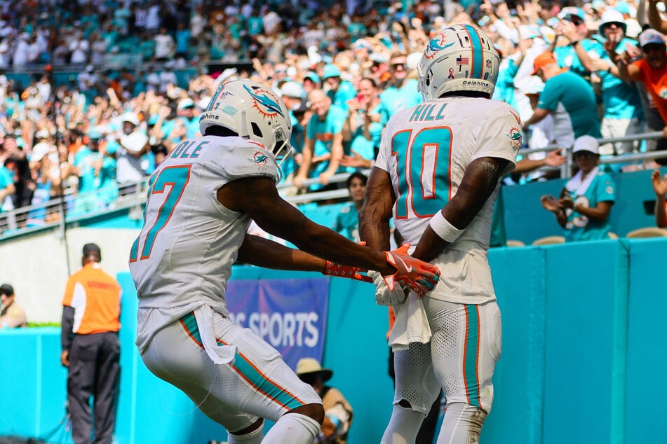 Tyreek Hill (r.) and his Miami Dolphins teammate poked fun at the incident with their touchdown celebration on Sunday.