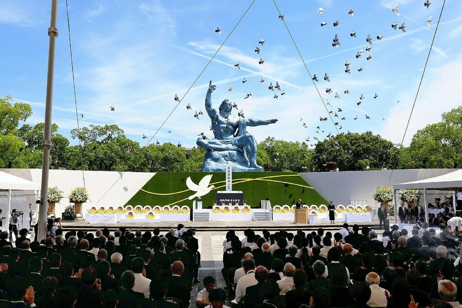 Pigeons are released during a prayer ceremony at the Peace Park in Nagasaki on August 9, 2024, during commemorations to mark the 79th anniversary of the atomic bombing of the city.