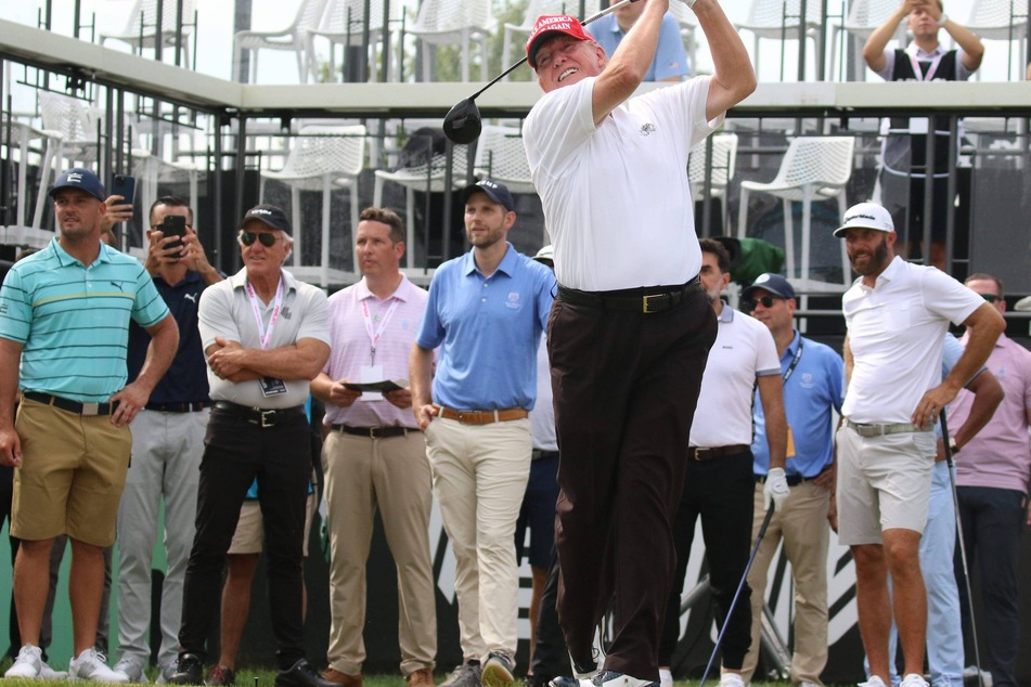 Donald Trump hits the ball off the first tee during The LIV Pro Am Tournament in Bedminster, New Jersey, on July 28, 2022.