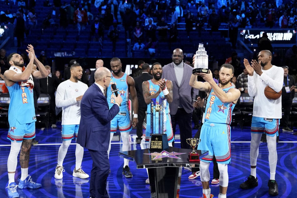 Shaq’s OGs guard Stephen Curry of the Golden State Warriors celebrates with the MVP trophy after defeating Chuck’s Global Stars during the 2025 NBA All-Star Game at Chase Center.