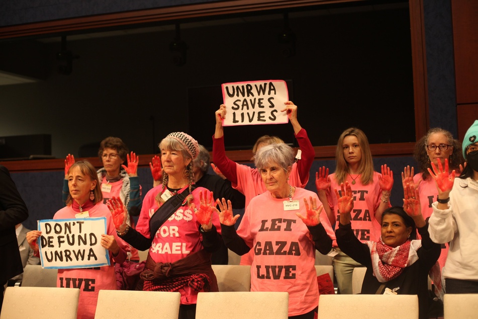 Activists with CODEPINK disrupt a US House hearing on the Palestinian aid agency UNRWA to decry the Biden administration's decision to cut off funding.
