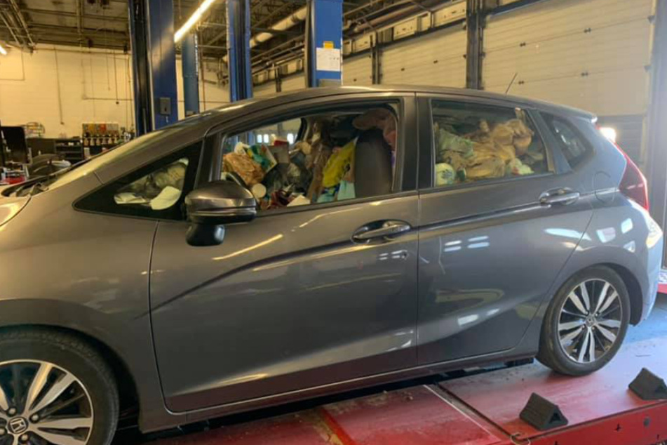 The car is packed full of litter.