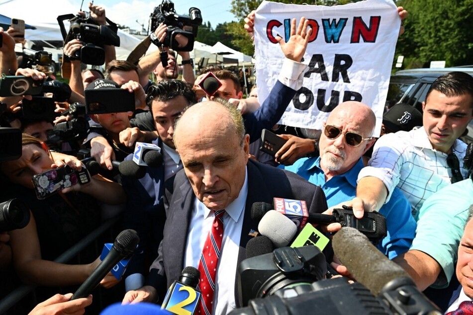 Rudy Giuliani speaks to reporters after being booked, outside the Fulton County Jail in Atlanta, Georgia, on August 23, 2023.