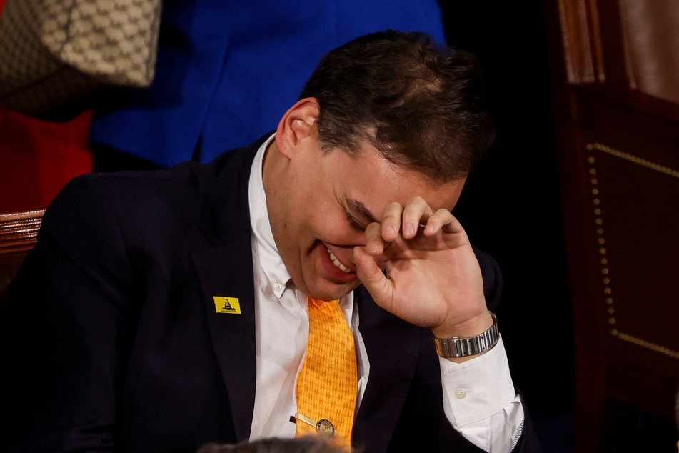 George Santos sits in the House Chamber prior to President Joe Biden delivering his 2023 State of the Union address.