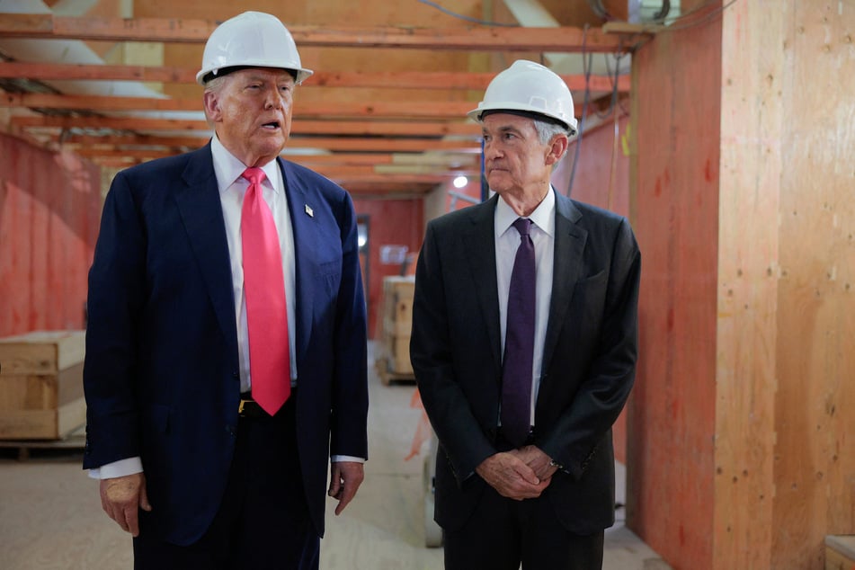 President Donald Trump (l.) delivers remarks alongside Federal Reserve Chair Jerome Powell as they tour the central bank’s $2.5-billion headquarters renovation project in Washington DC on July 24, 2025.