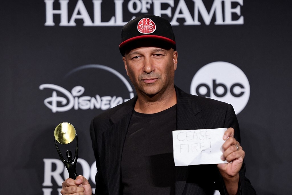 Tom Morello holds a piece of paper reading "CEASEFIRE!" during the 38th Annual Rock &amp; Roll Hall Of Fame Induction Ceremony at New York City's Barclays Center on November 3, 2023.