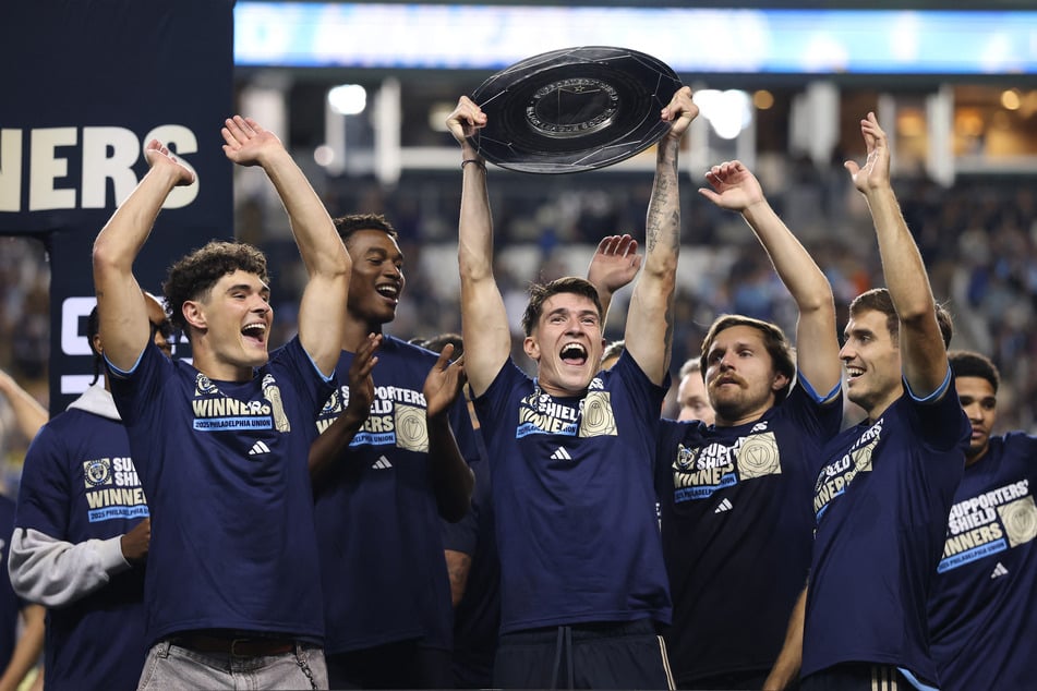 Jovan Lukic of the Philadelphia Union lifts the Supporters Shield trophy after their MLS match against New York City FC at Subaru Park on October 4, 2025.