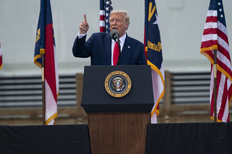 Donald Trump mocks his opponent Biden for wearing a mask in public.