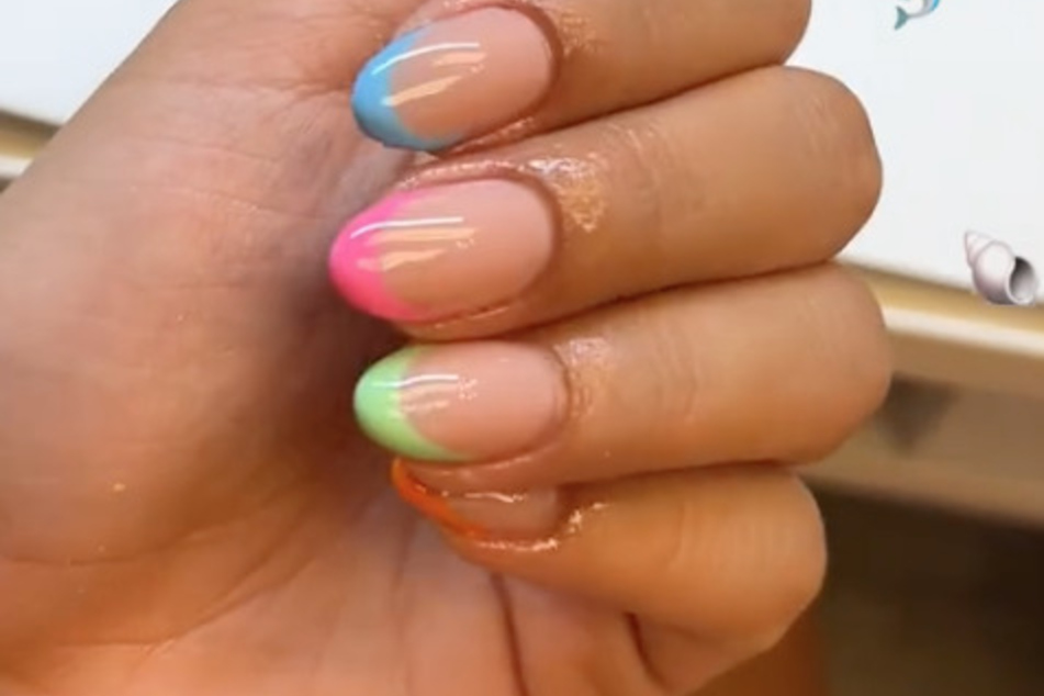 TikToker @gabyalabado26 put a colorful spin on the traditional French mani with this rainbow twist.