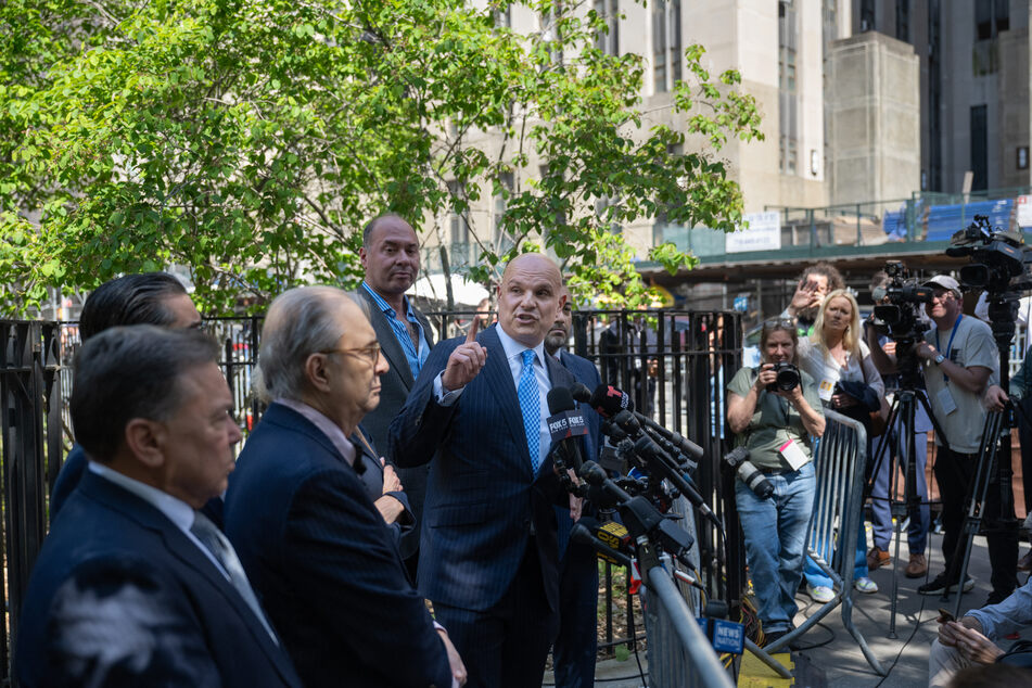 Arthur Aidala (c.), lawyer for Harvey Weinstein, addresses the media outside of Criminal Court on Wednesday in New York City.