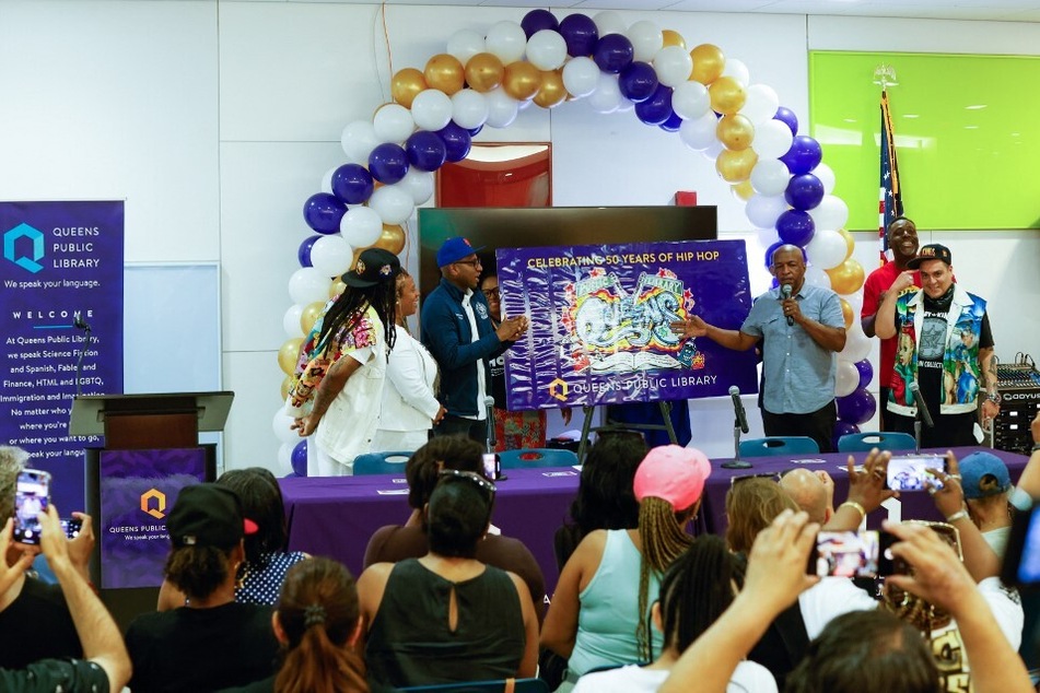 Ralph McDaniels (second from r.), Hip Hop Coordinator for Queens Public Library, speaks during the official launch of the Special Edition Hip-Hop Library Card.