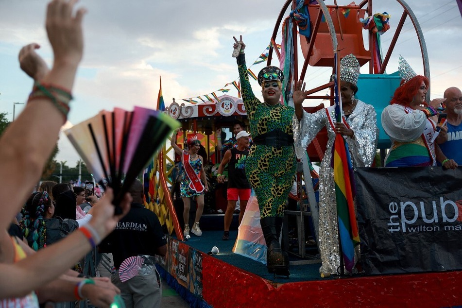Drag queens ride on a float during the Stonewall Pride parade on June 17, 2023, in Wilton Manors, Florida.