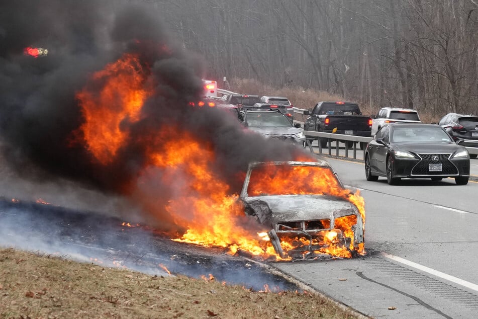 A car is on fire after an accident on the Taconic State Parkway near West Mahopac on Sunday in New York.