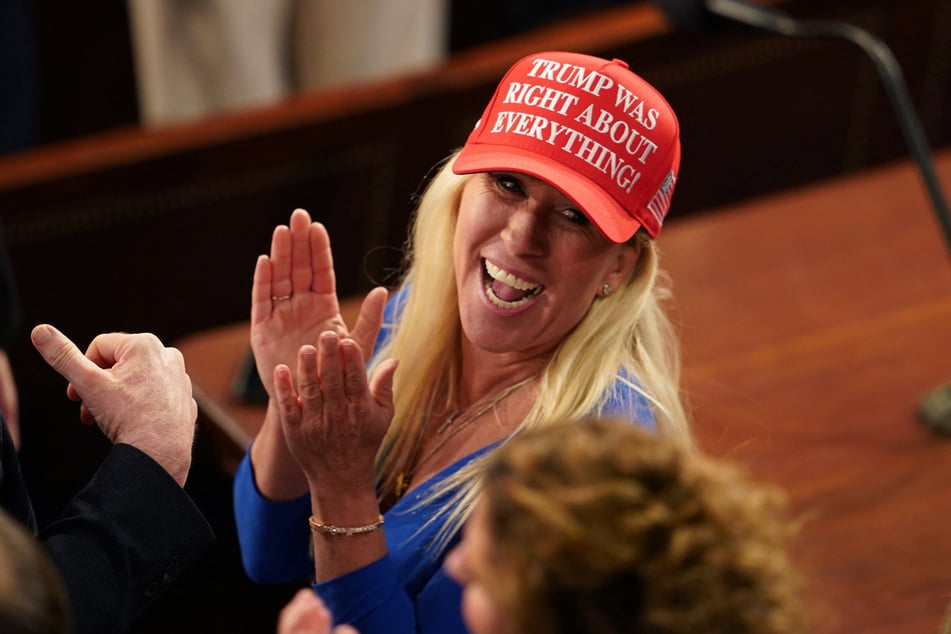 Representative Marjorie Taylor-Greene (R-GA) looks on as President Donald Trump speaks during an address to a joint session of Congress in Washington, DC, on March 4, 2025.