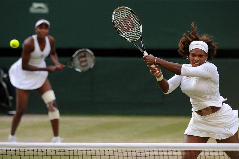 Venus (l) and Serena (r) Williams wearing white as part of the Wimbledon all-white dress code.