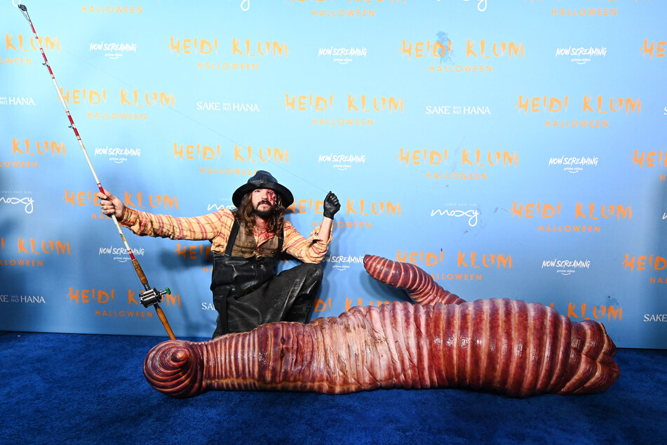 Tom Kaulitz and Heidi Klum went as a fishman and a worm for Halloween 2022.