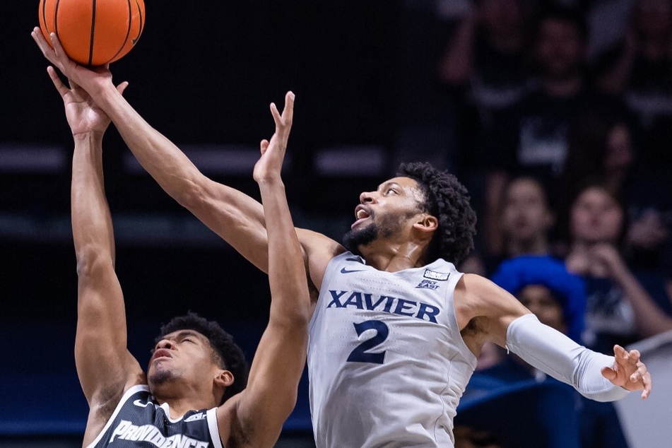 Jerome Hunter (r) of Xavier basketball showed up big during his first start of the season against Providence on Wednesday, after replacing injured starter Zach Freemantle.