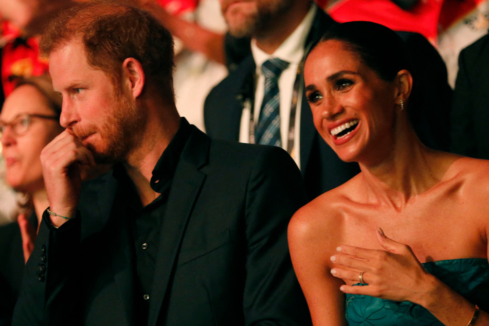 Meghan Markle (r.) and Prince Harry have been estranged from the British royal family since stepping down from their official duties.