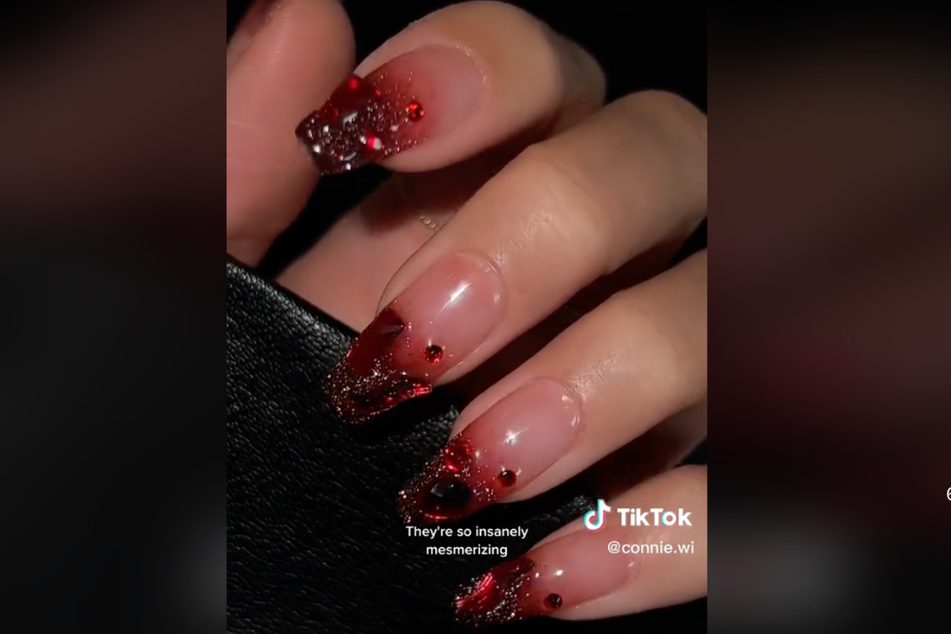 Rubies are a gal's best friend too! For the red lovers who want to spice things up, TikTok user connie.wi's ruby nails are a perfect option.