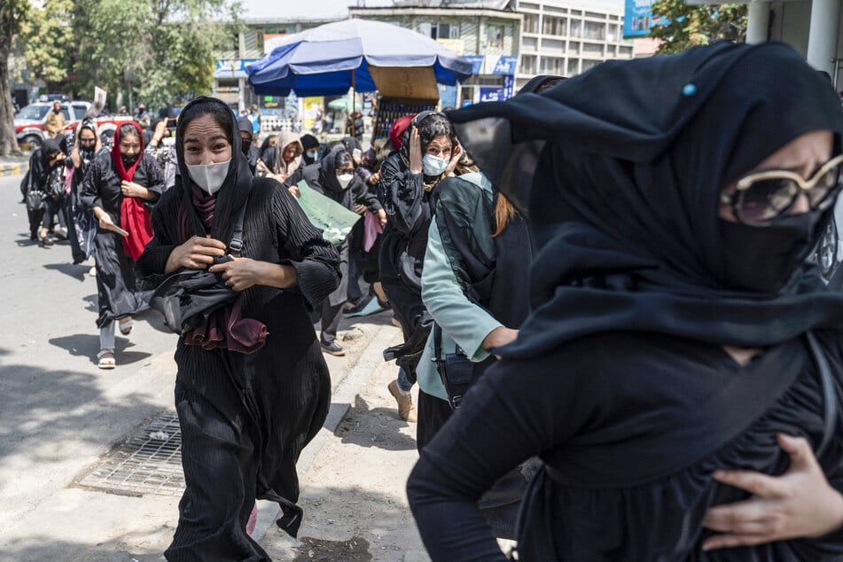 Taliban fighters beat women's rights protesters and fired into the air on August 13, 2022, days ahead of the first anniversary of the hardline Islamists' return to power.