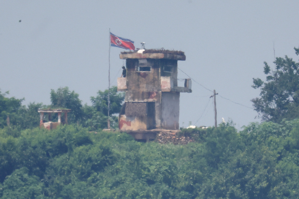 A soldier stands guard at the North Korean post at the demilitarized zone separating the two Koreas.