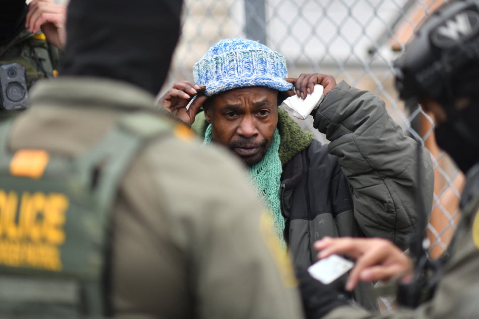 US Border Patrol agents detain a man of Somali descent in Minneapolis, Minnesota, on January 8, 2026.