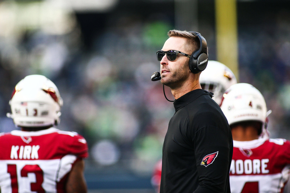 Cardinals head coach Kliff Kingsbury looks up at the scoreboard during the game.