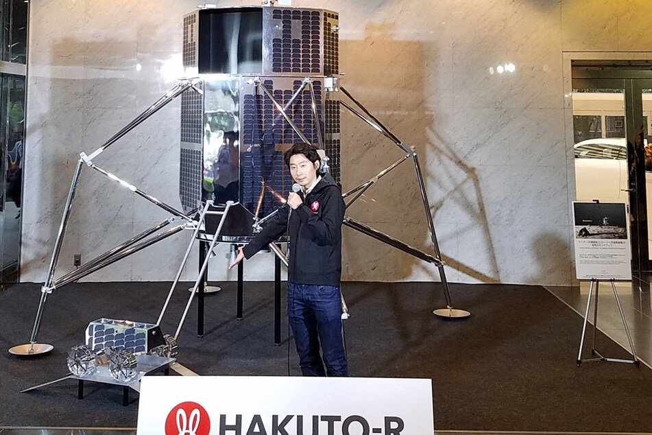 Takeshi Hakamada, CEO of Japanese firm ispace, holds a press conference to describe his company's lunar lander and rover for their lunar program Hakuto-R in Tokyo on September 26, 2018.
