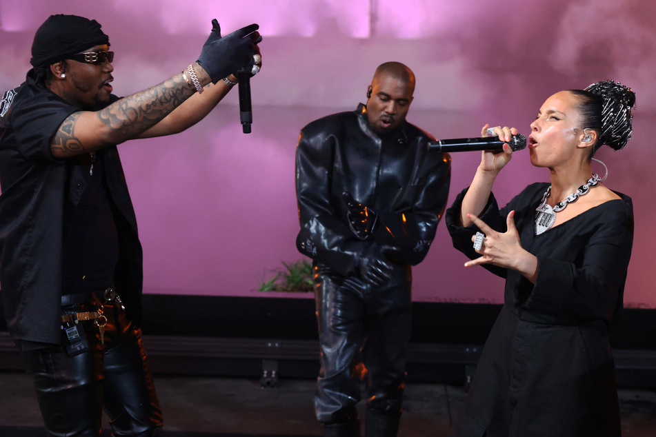 (From l. to r.) Fivio Foreign, Kanye West, and Alicia Keys at the Donda 2 listening party at LoanDepot Park in Miami, Florida on February 22.