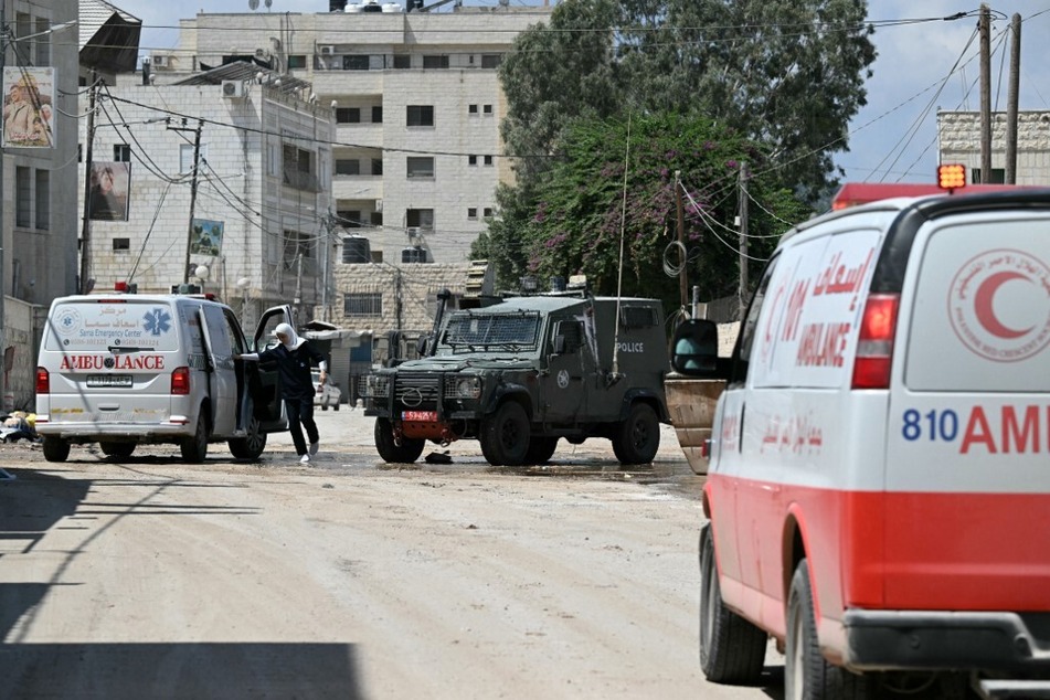 An Israeli army checkpoint is set up on a road leading to a hospital in Jenin in the occupied West Bank on August 30, 2024, where ambulances are checked before reaching the medical facility.