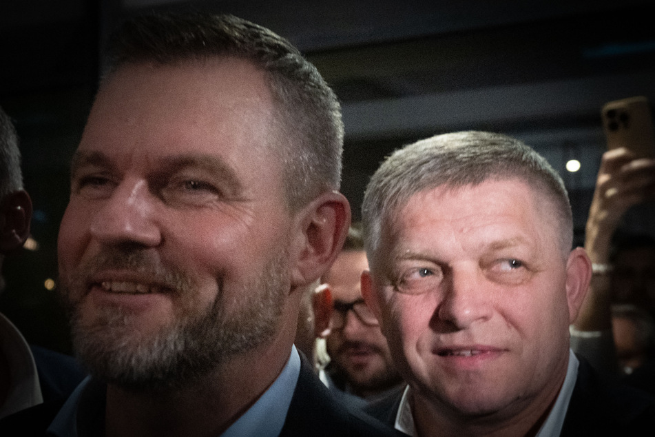 Presidential candidate Peter Pellegrini (l.) and Slovak Prime Minister Robert Fico (r.) speak to journalists after the announcement of Pellegrini's victory in the second round of the Slovak presidential elections, April 6, 2024 in Bratislava, Slovakia.