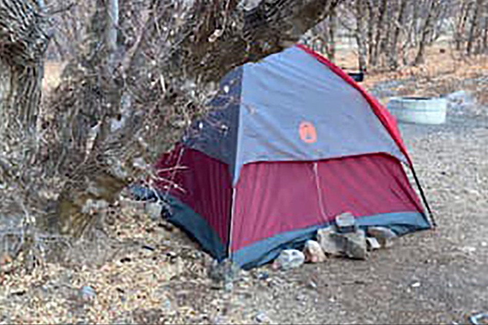 The woman lived in this tent for six months.