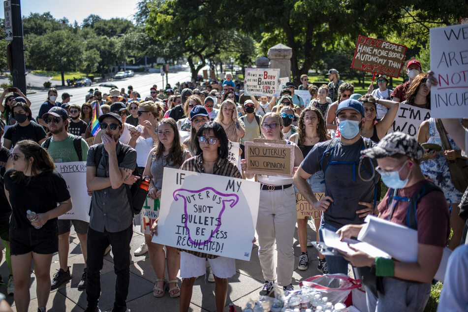 Protesters hold up signs during an abortion-rights rally on June 25, 2022 in Austin, Texas.