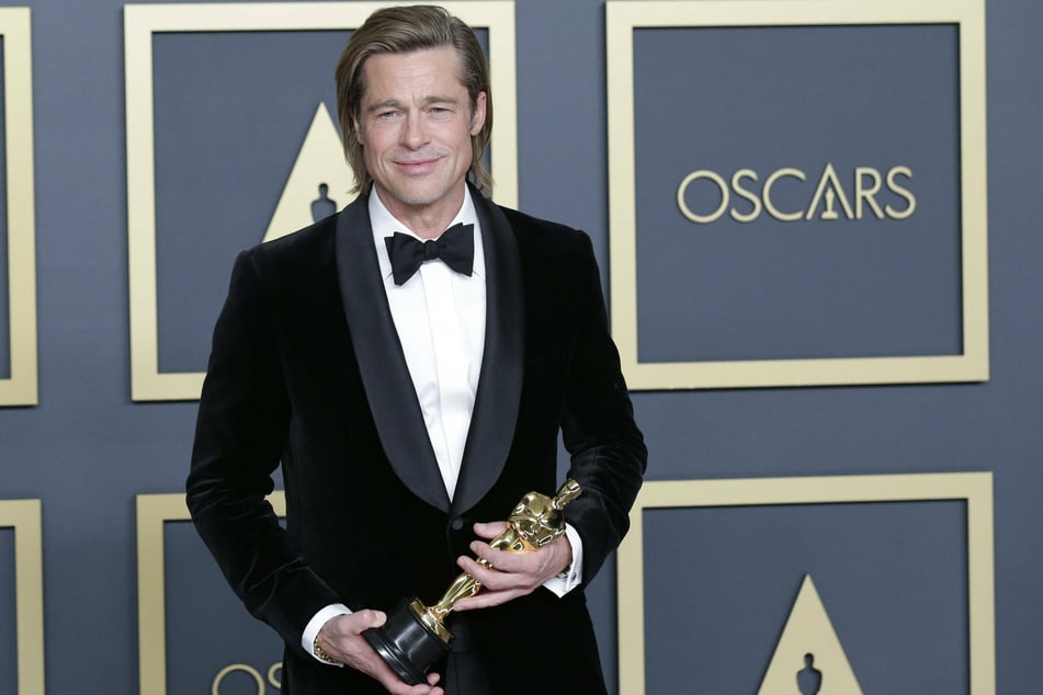 Brad Pitt (56) holds the Oscar for best supporting actor at the 92nd Academy Awards ceremony in the Dolby Theatre.