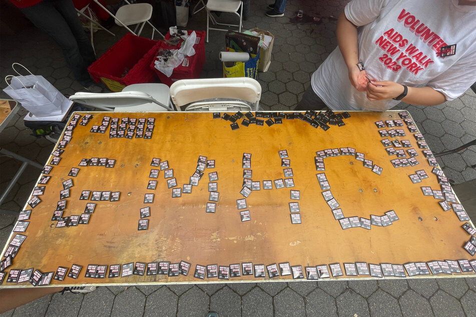 Hundreds of volunteers donated their time in support of Gay Men's Health Crisis (GMGC), and handed out pins to participants.