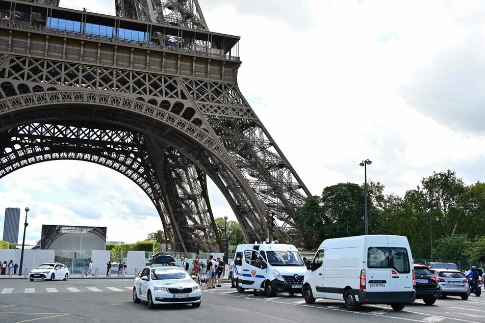 Law enforcement officers secures the area in central Paris on Saturday after a security alert prompted the evacuation of three floors of the Eiffel Tower in France.