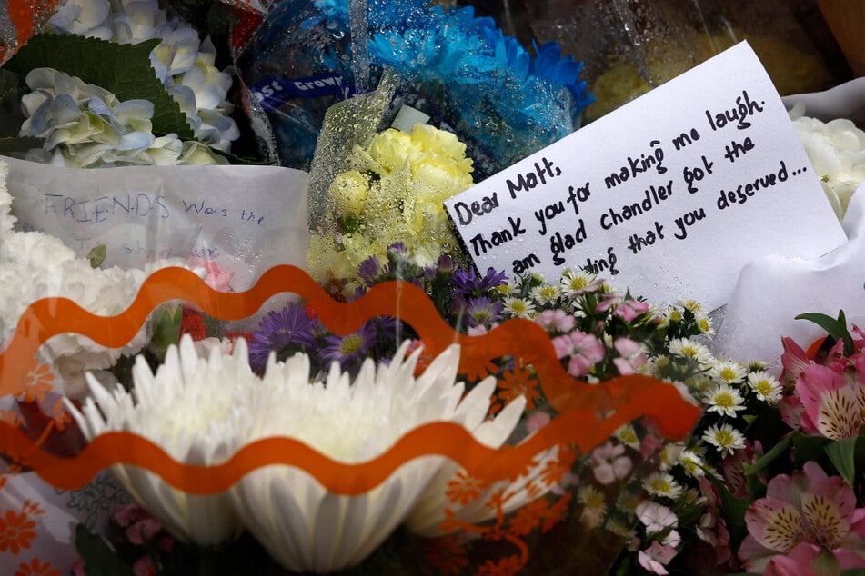 Tributes from fans were placed as a memorial to the late actor Matthew Perry outside "the Friends building" in New York City.
