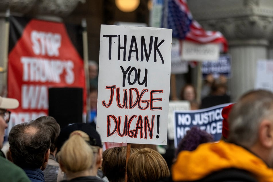 More than 150 former state and federal judges signed a letter to the Justice Department calling Judge Dugan's arrest an attempt to intimidate the judiciary.